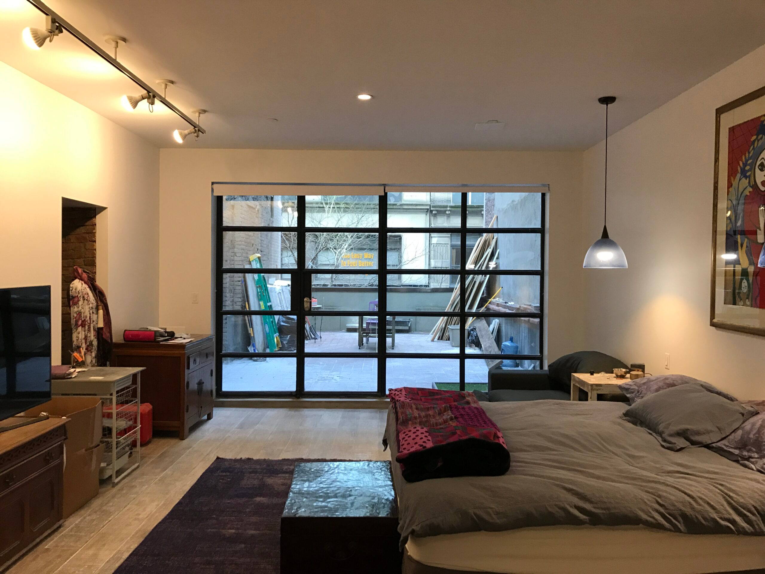 New York residential interior renovation with large steel framed terrace doors